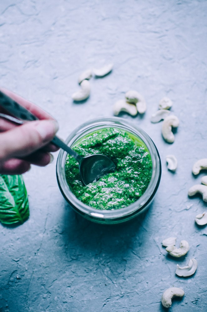  Easy Vegan Cashew Pesto Recipe -  This Vegan Basil Cashew Pesto recipe could not be tastier! Made with just a handful of simple, healthy ingredients, this creamy vegan pesto makes a vibrant accompaniment to variety of foods and dishes! #veganpesto #veganpestorecipe #easyveganpesto #cashewpesto #basilcashewpesto #vegancashewpesto  