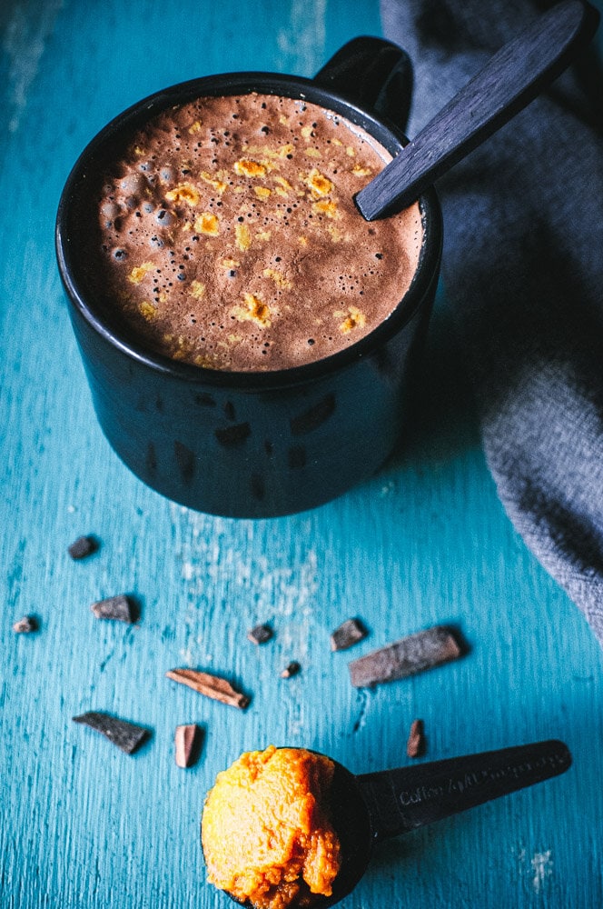  Healthy Pumpkin Hot Chocolate Recipe -  This super creamy and delicious Healthy Hot Chocolate Recipe with Pumpkin is like pumpkin pie in a cup! This autumn beverage made with cacao powder, plant-based milk, pumpkin puree and a dash of warming spices is a nutritious way to get your pumpkin fix sans guilt. Vegan, dairy-free, soy-free, gluten-free + refined sugar-free! #healthyhotchocolate healthy hot chocolate #pumpkinhotchocolate pumpkin hot chocolate recipe hot cacao #hotcacao  
