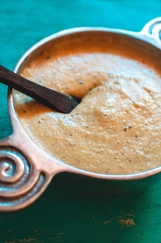  The Best Vegan White Cashew Gravy - A super creamy and comforting Gluten-Free Vegan White Gravy made with Cashews, and the perfect blend of spices! Whether for a cozy holiday meal or your every day favorite dishes, this Vegan Gravy recipe adds that certain bit of something special in no time at all! #vegangravy #glutenfreegravy #vegetariangravy 