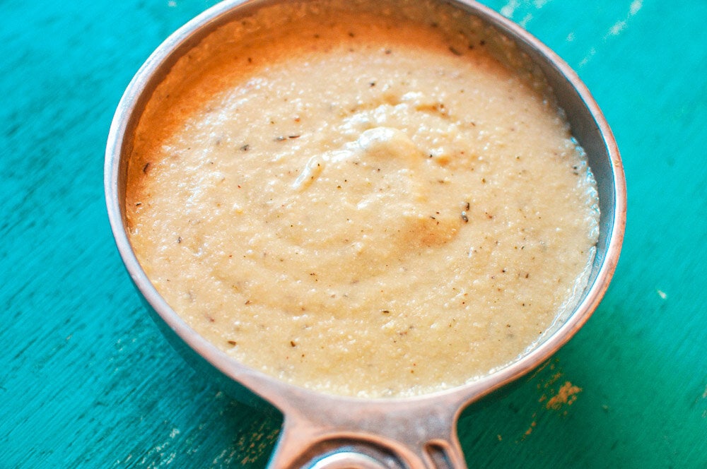  The Best Vegan White Cashew Gravy - A super creamy and comforting Gluten-Free Vegan White Gravy made with Cashews, and the perfect blend of spices! Whether for a cozy holiday meal or your every day favorite dishes, this Vegan Gravy recipe adds that certain bit of something special in no time at all! #vegangravy #glutenfreegravy #vegetariangravy 