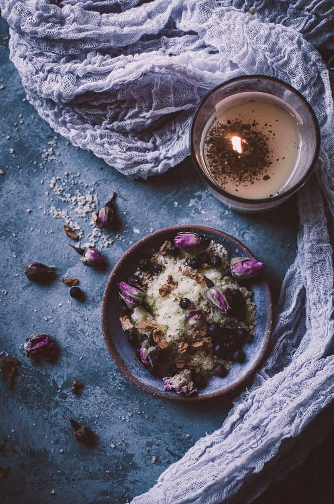 candles rose buds and bowls of bath salts