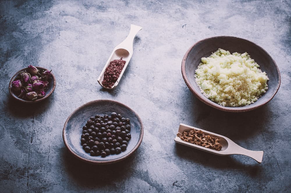 shallow ceramic bowls filled with bath salts ingredients