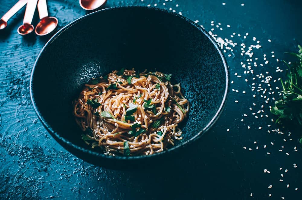 black bowl of sesame noodles