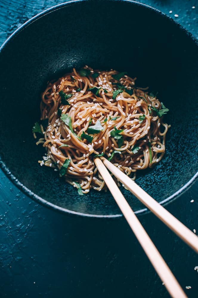 black bowl noodles chopsticks