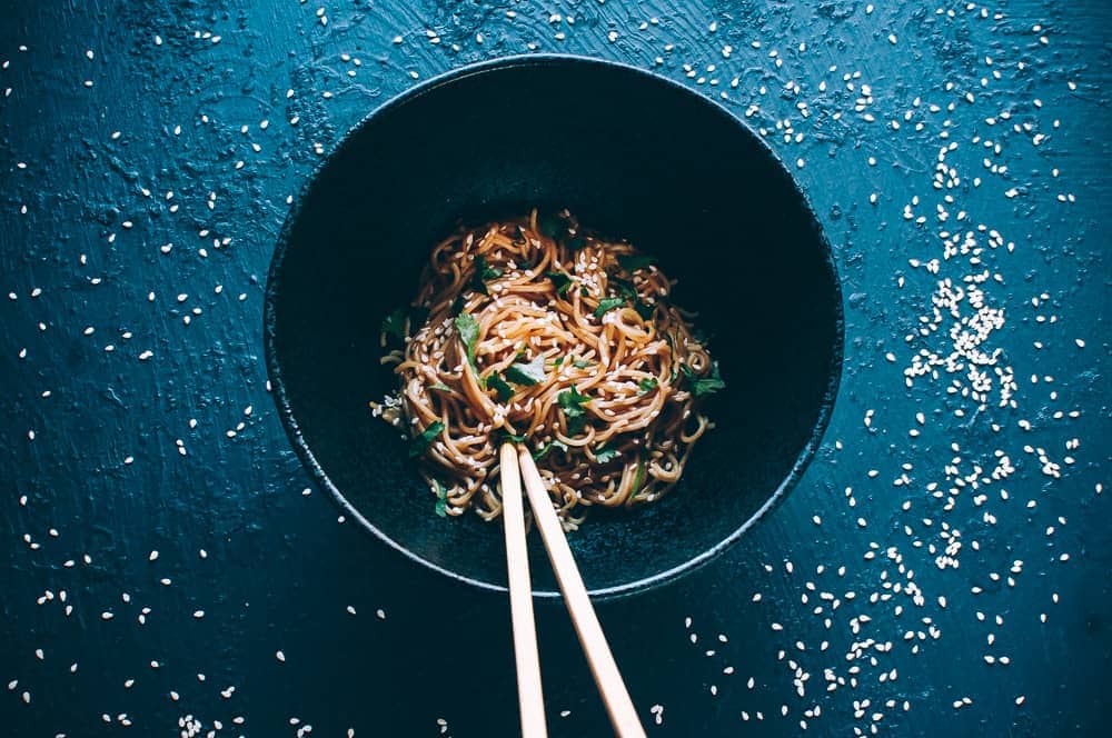 black bowl chopsticks sesame noodles