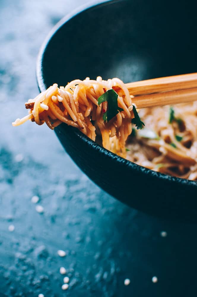 close up ramen noodle wrapped chopsticks