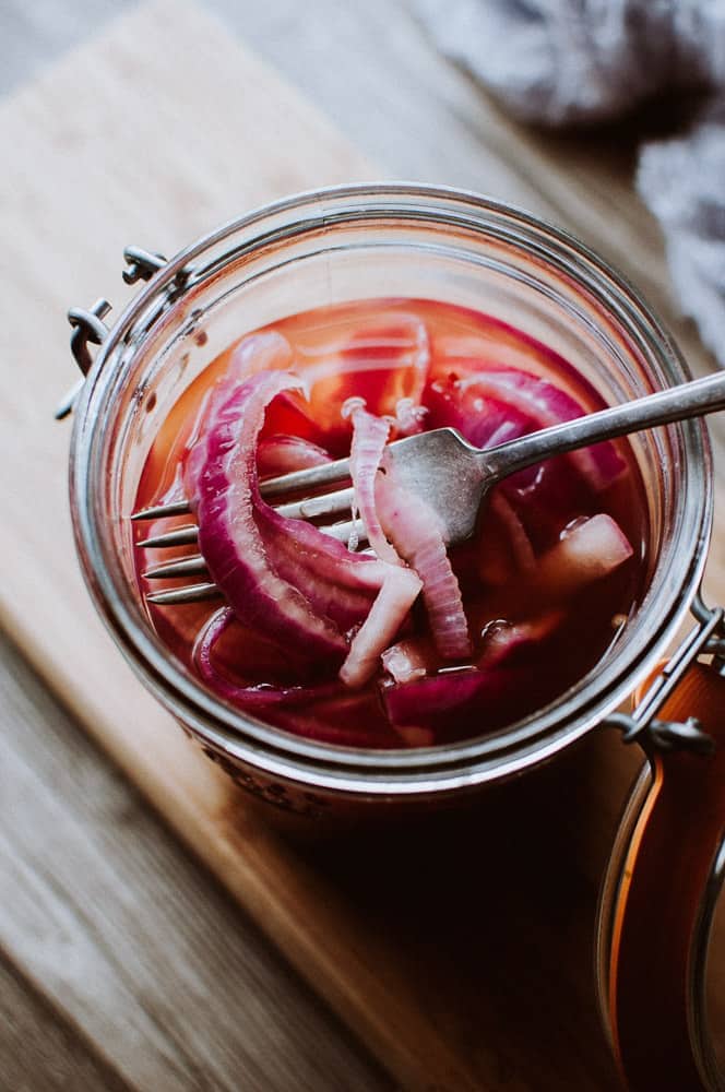 an open jar of pickled red onions