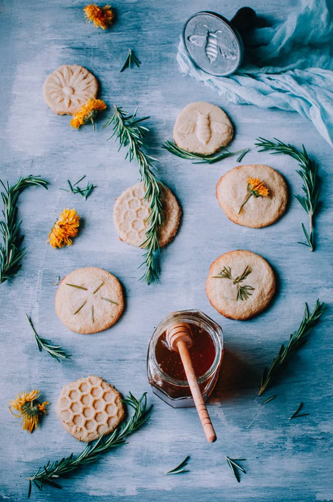 flatlay light blue wooden backdrop shortbread cookies honey and nordic ware cookie stamps