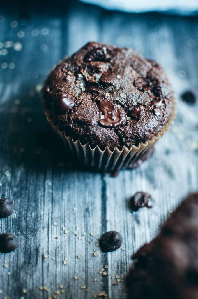 a close up of a chocolate zucchini muffin