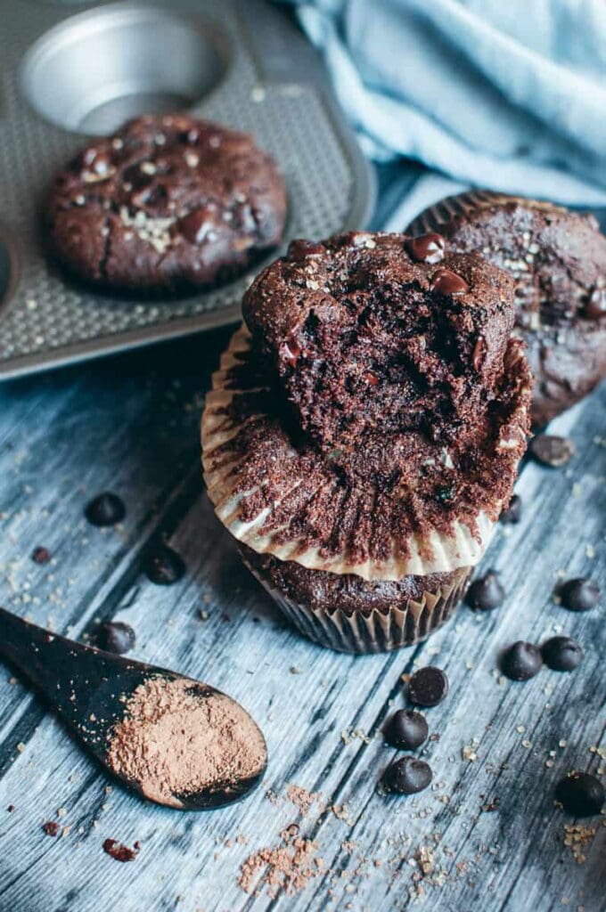 a stack of chocolate muffins sprinkled 