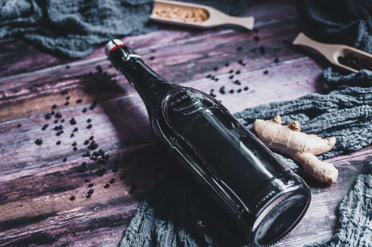 a glass bottle on a wooden backdrop
