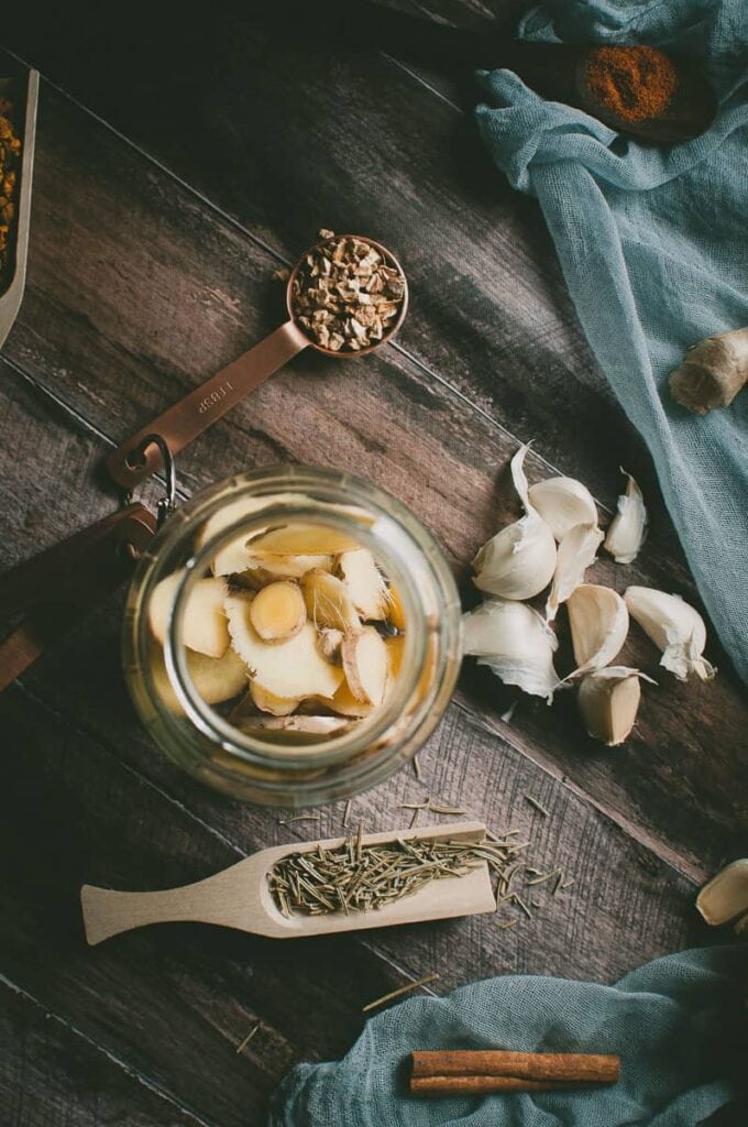 an open jar of sliced ginger root