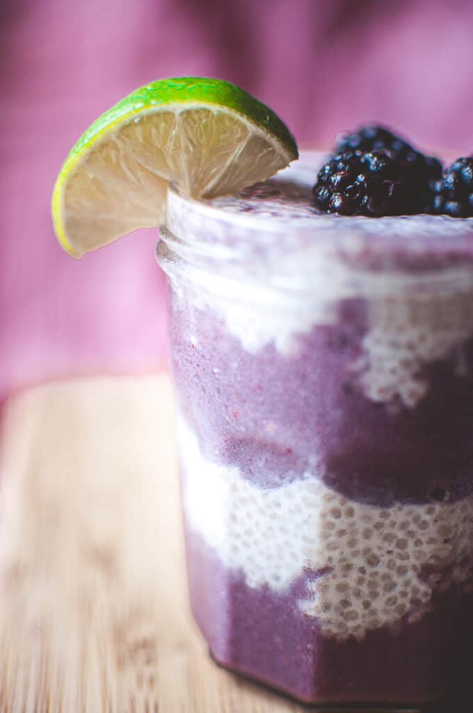 a close up shot of layers of a chia seed parfait