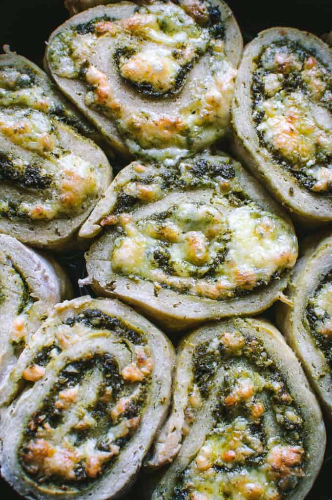 a close up shot of pesto pizza rolls