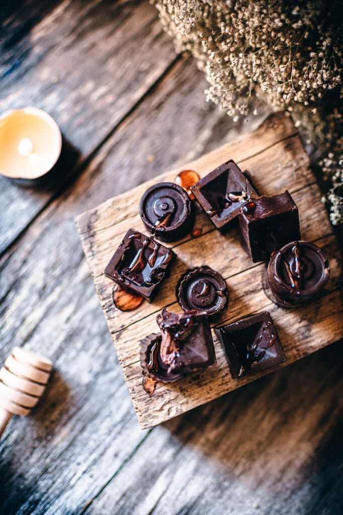 a top shot of chocolates drizzled with honey