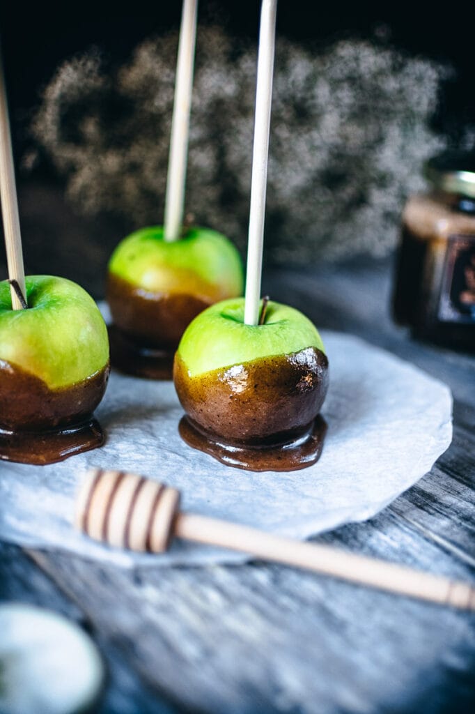 a green apple enveloped in coconut caramel