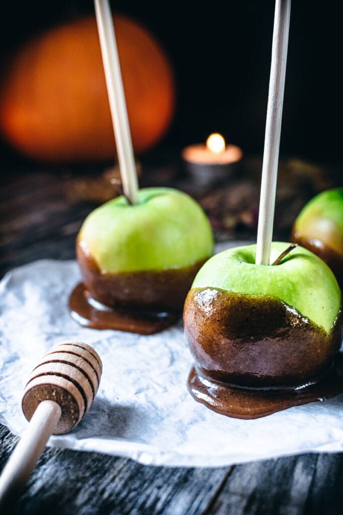 a close up shot of a honey caramel apple