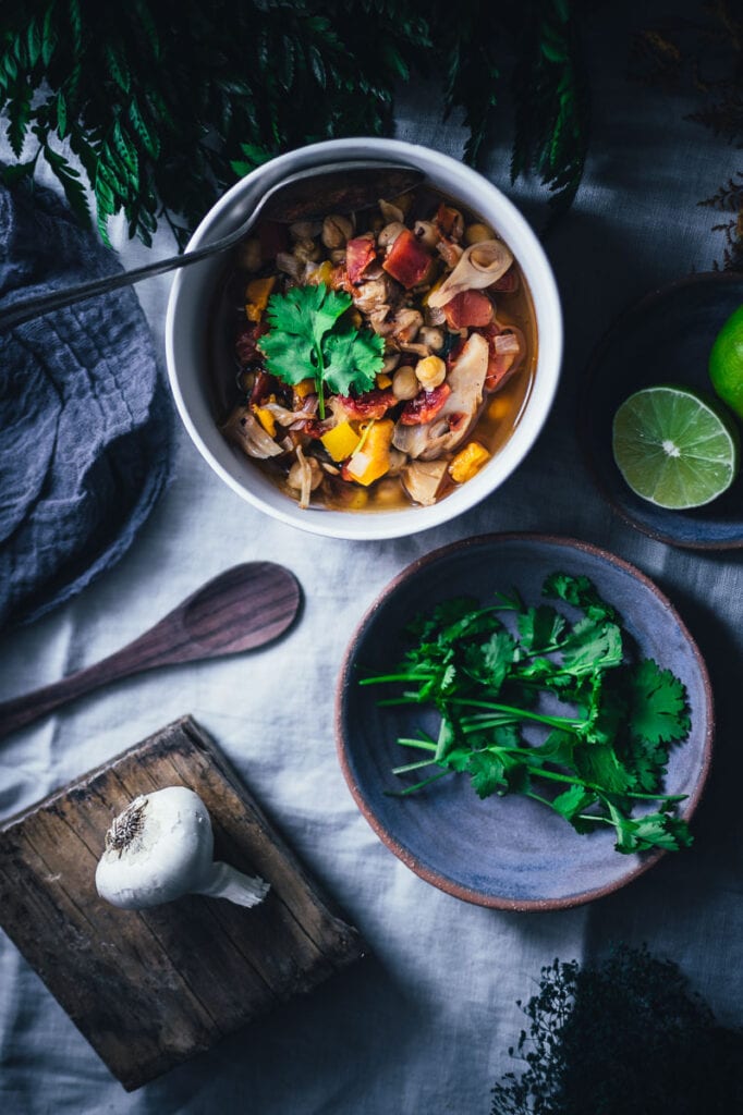 a flatlay top shot of chili cilantro limes and plants