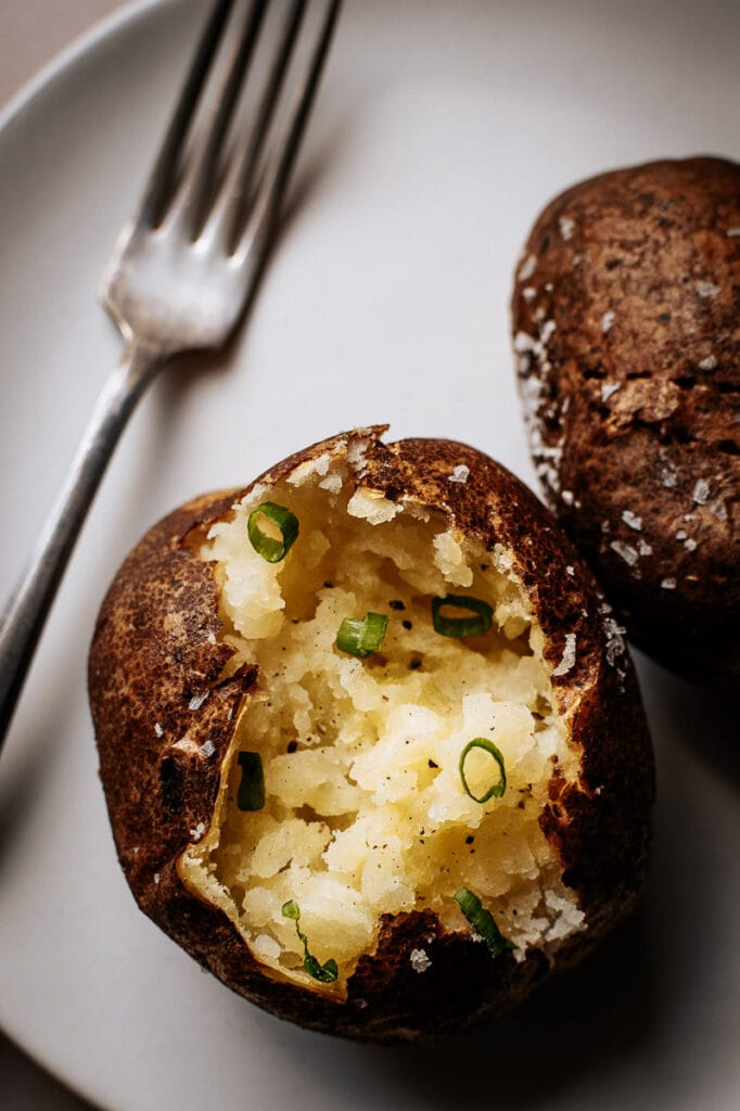 a close up of the fluffy interior of an air fryer baked potato