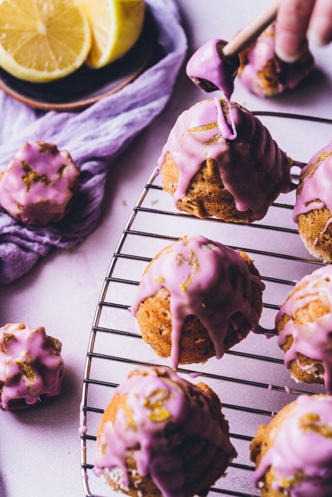 Super easy, healthy and delicious Gluten-Free Honey Cake with notes of lavender and lemon. This rich and decadent cake (or mini-cakes!) are bursting with vibrant flavors and topped with a purple glaze for that extra special touch.