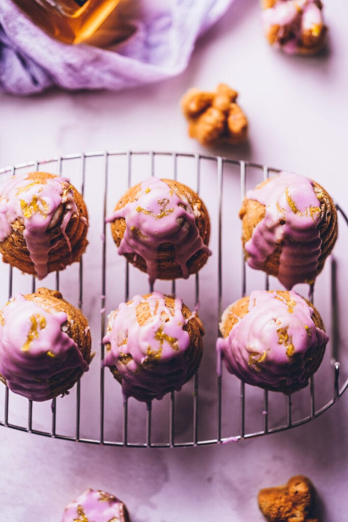 Super easy, healthy and delicious Gluten-Free Honey Cake with notes of lavender and lemon. This rich and decadent cake (or mini-cakes!) are bursting with vibrant flavors and topped with a purple glaze for that extra special touch.