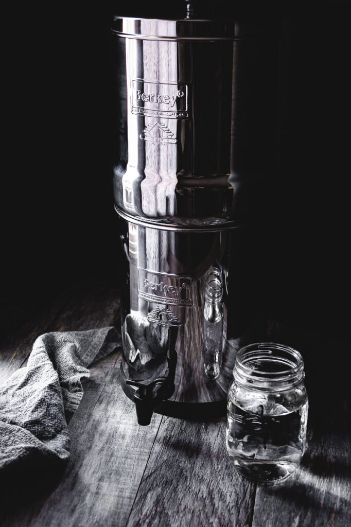 a big berkey water filter on a dark table