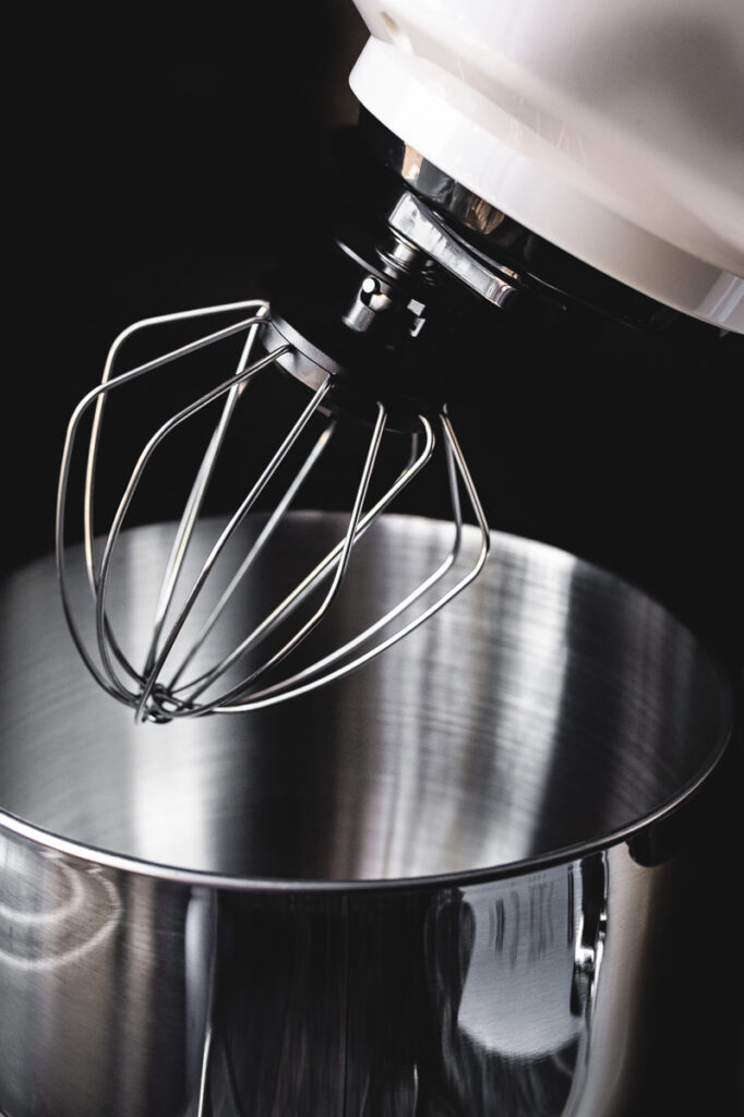 a close up shot of the whisk beater attachment for the hauswirt stand mixer