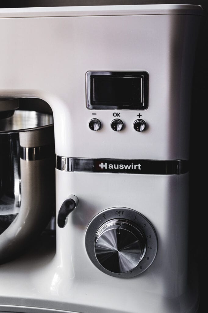 a close up shot of the dials and control of a hauswirt stand mixer