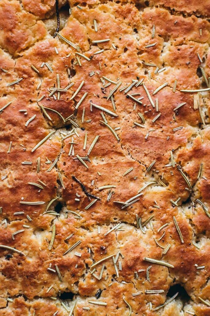 a close top view of the texture on top of freshly baked focaccia bread