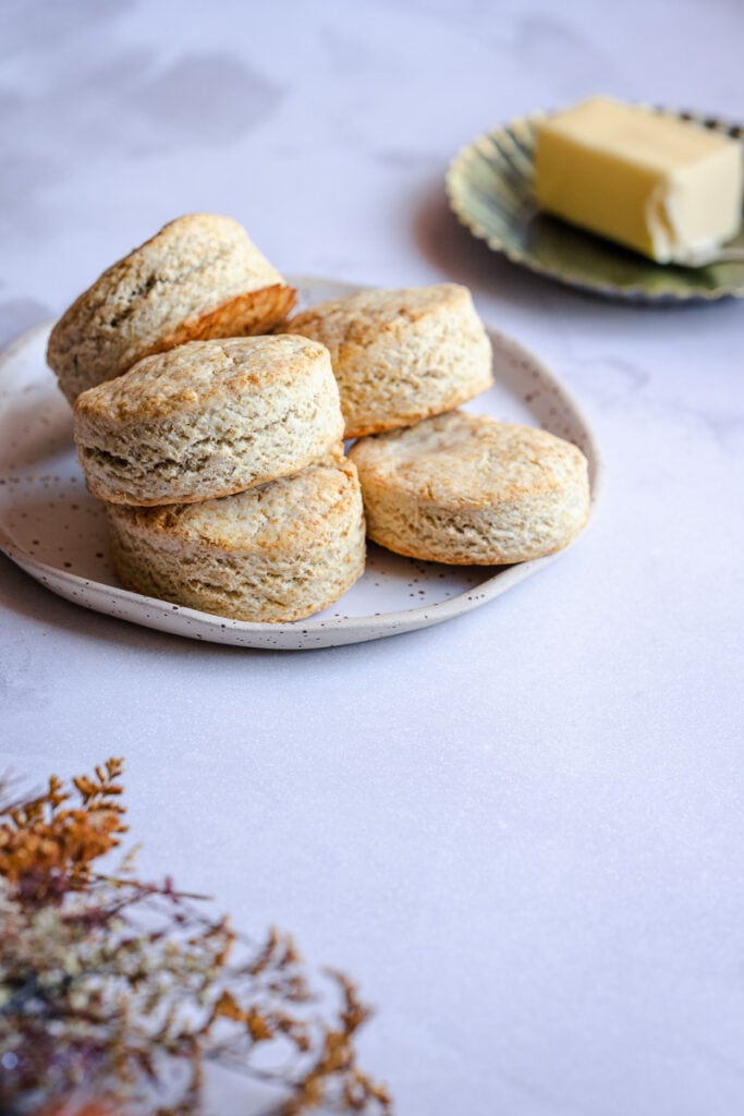 vegan gluten free biscuits resting on a white ceramic plate