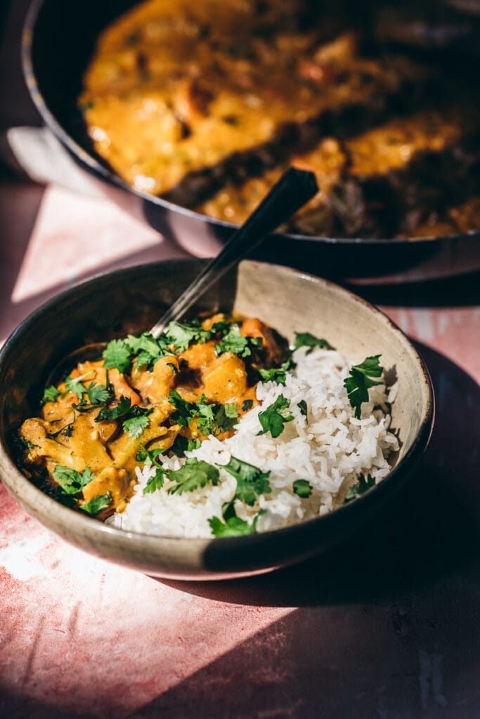 golden sunlight strikes a bowl of veggie curry