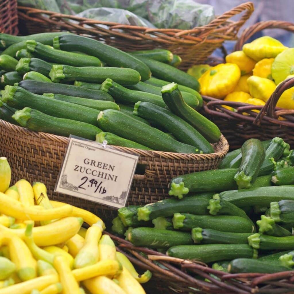 a variety of august summer squash at a market