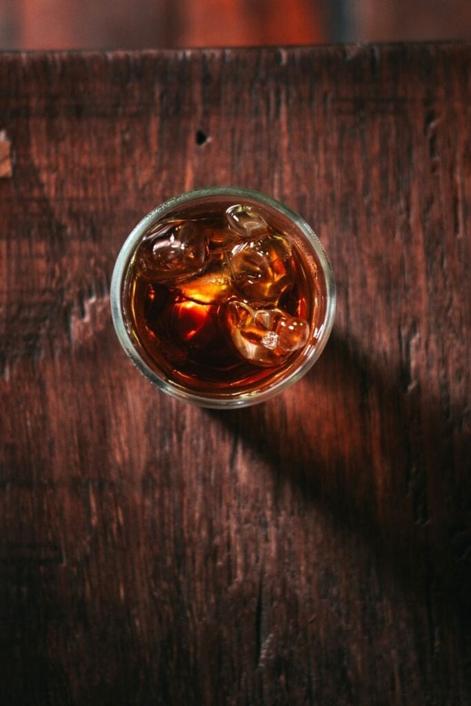 a top shot view of rum in a clear glass