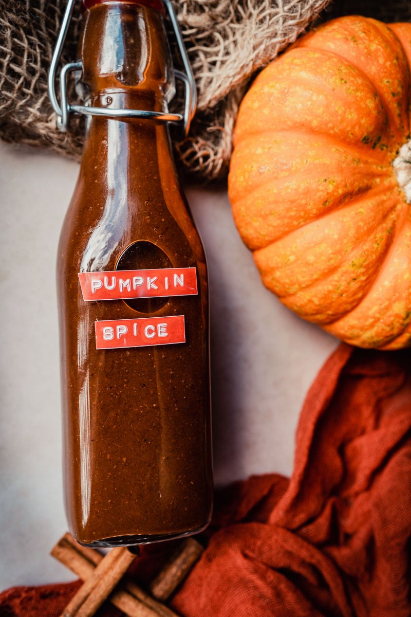 a freshly made bottle of easy homemade gluten free pumpkin spice syrup recipe
