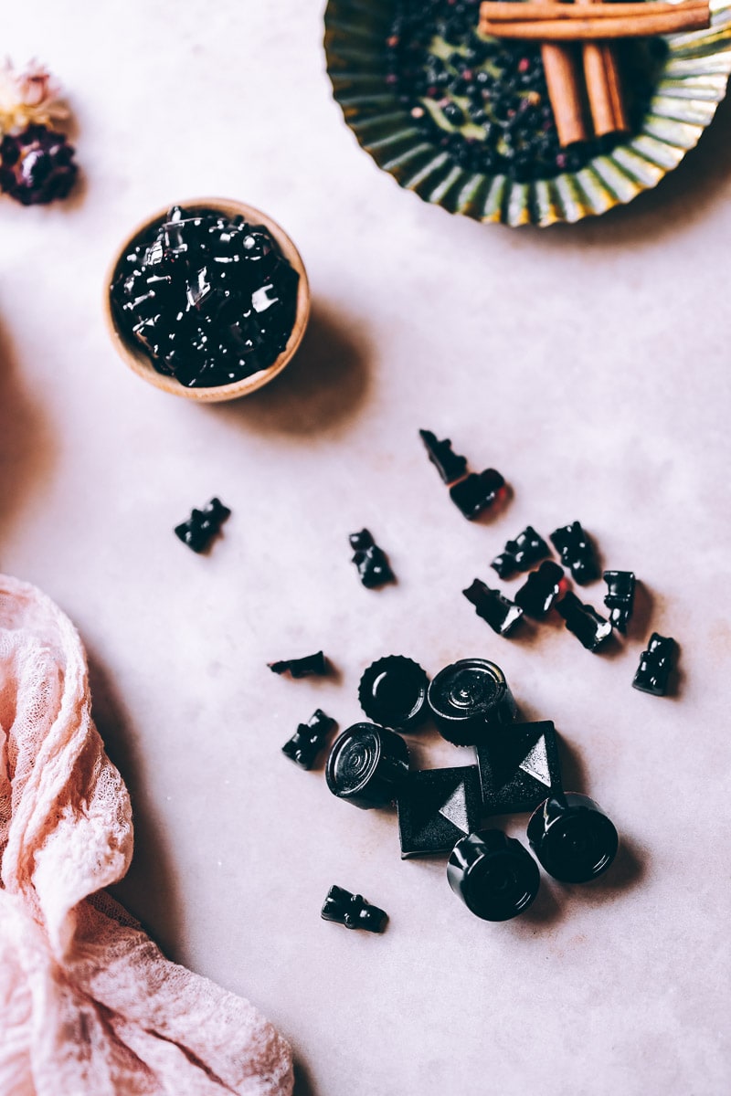 healthy elderberry gummy bears on a pink backdrop