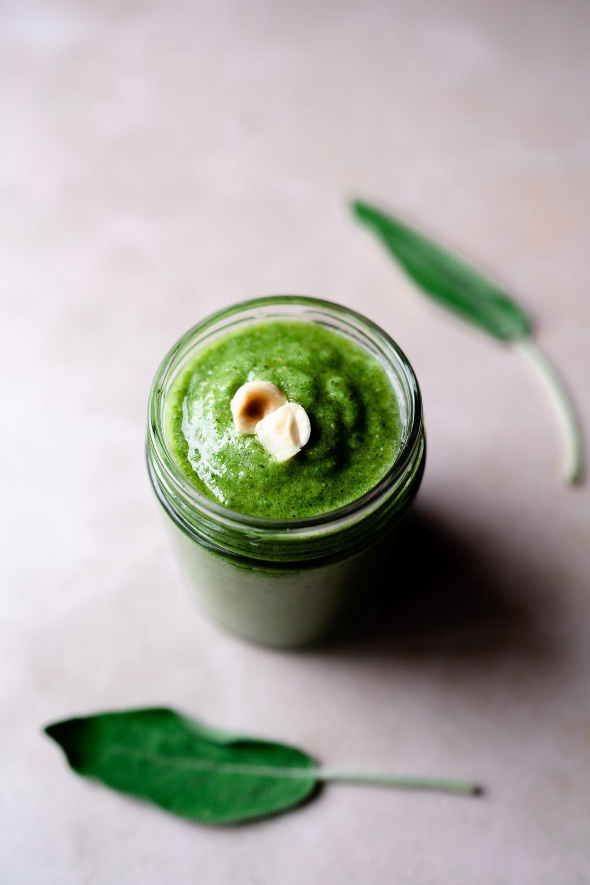 sage and hazelnut pesto in a clear jar