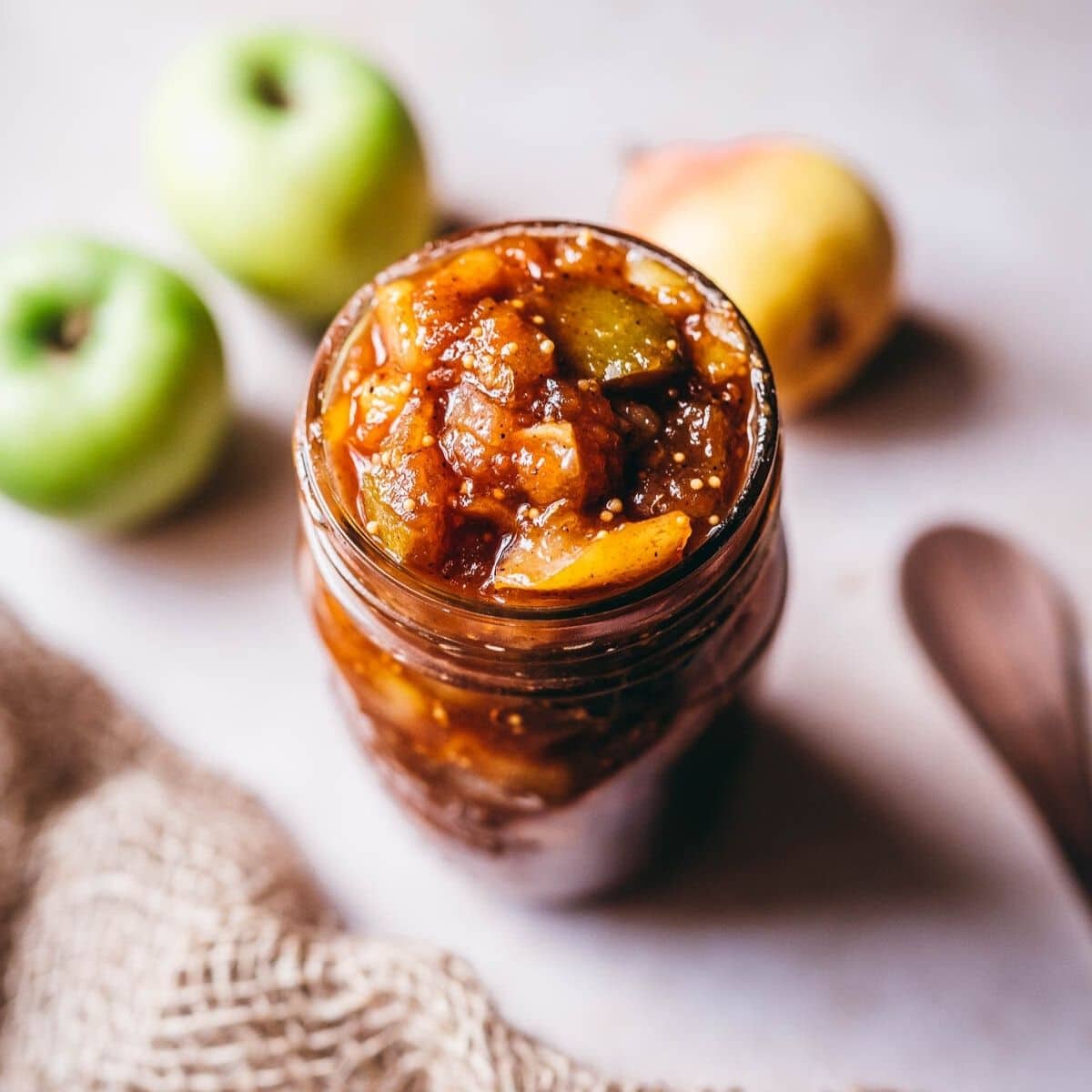 chunks of apple and pear chutney in a glass jar