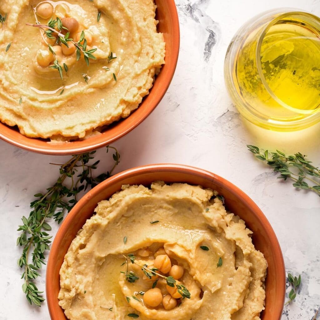 fresh homemade hummus in bowls