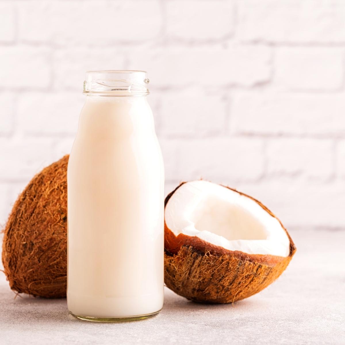 a tall glass jar of fresh coconut milk.