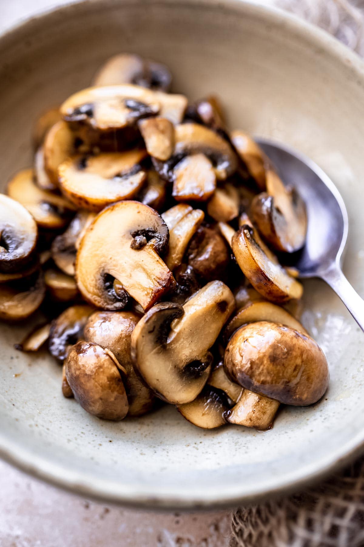 freshly cooked mushrooms resting in a bowl.