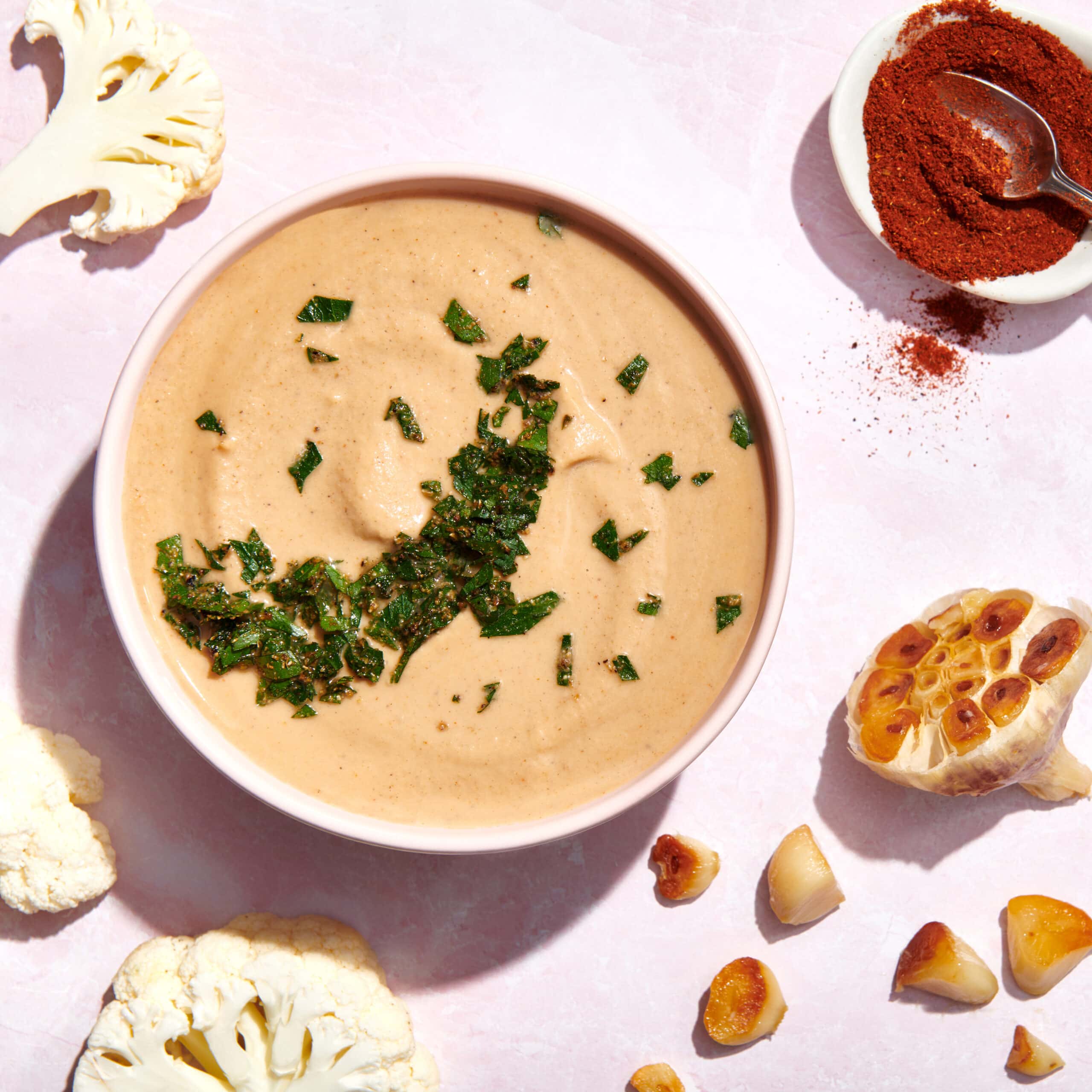 A white bowl filled with creamy soup.