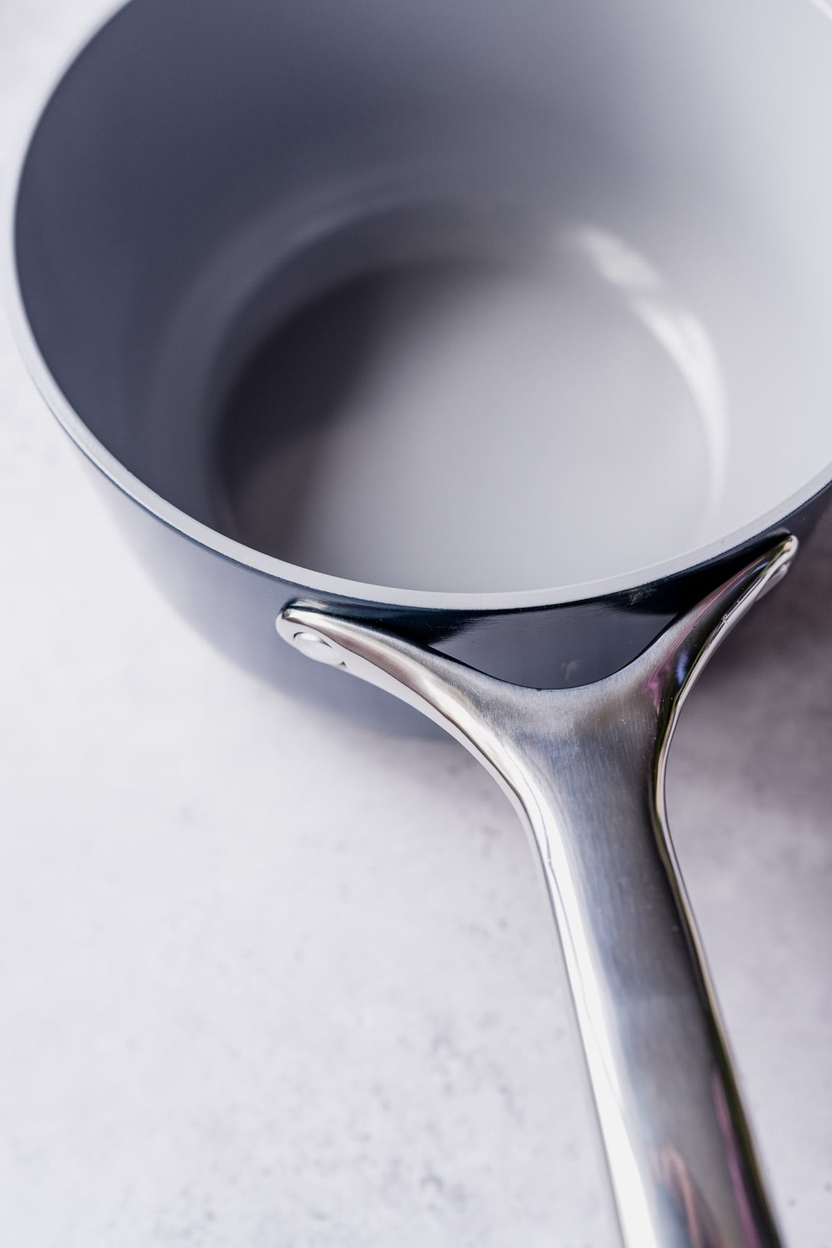 A blue and gray saucepan with a silver handle.