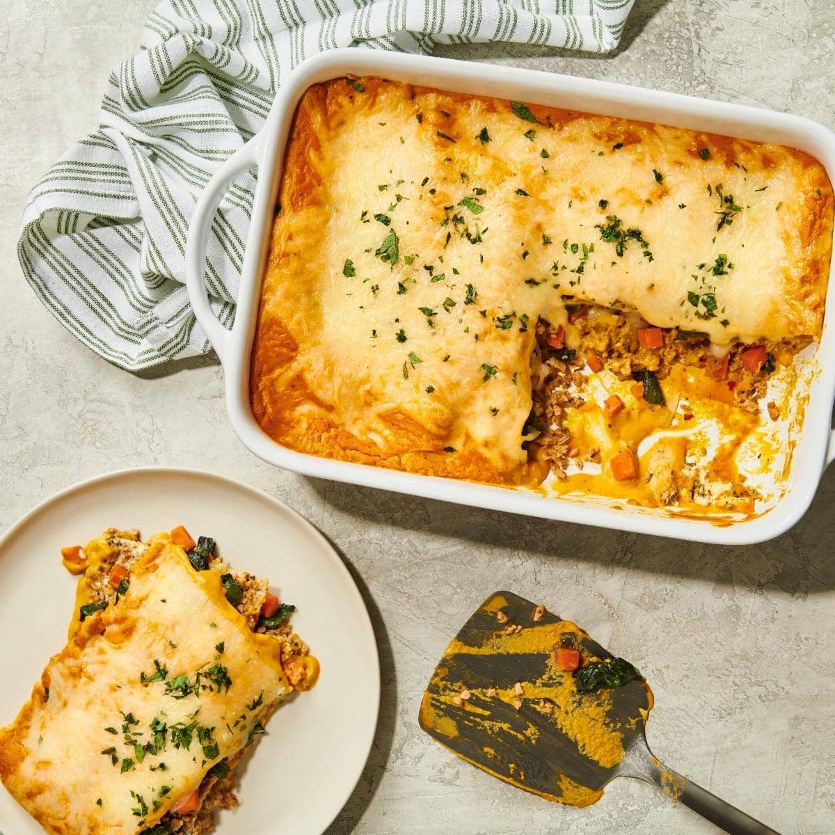 A large casserole dish filled with cheesy lasagna.