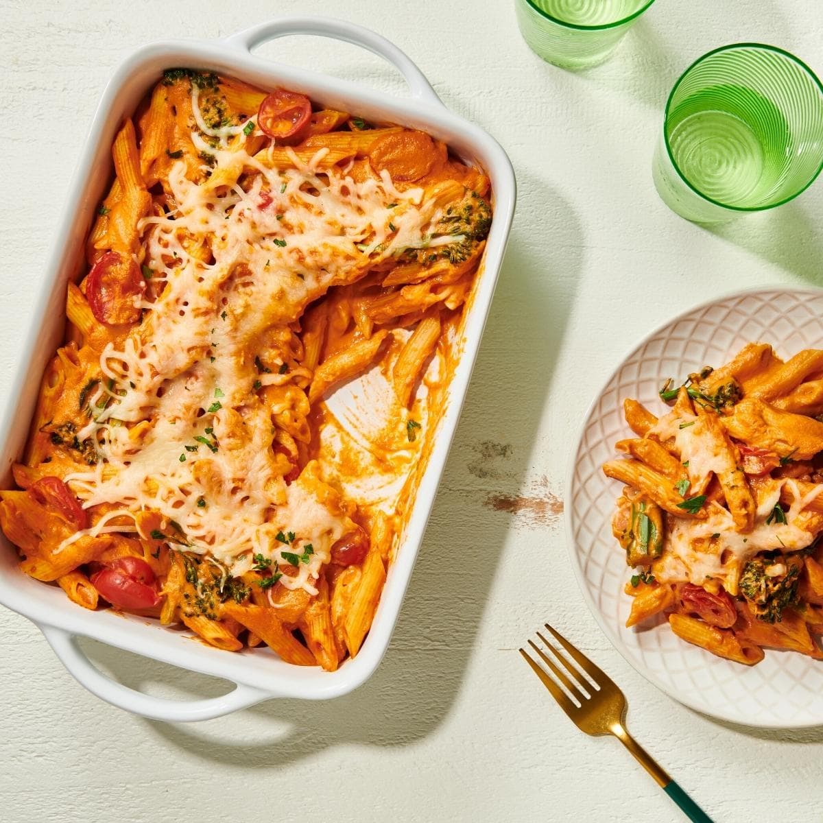 A large white casserole dish filled with cheesy pasta.