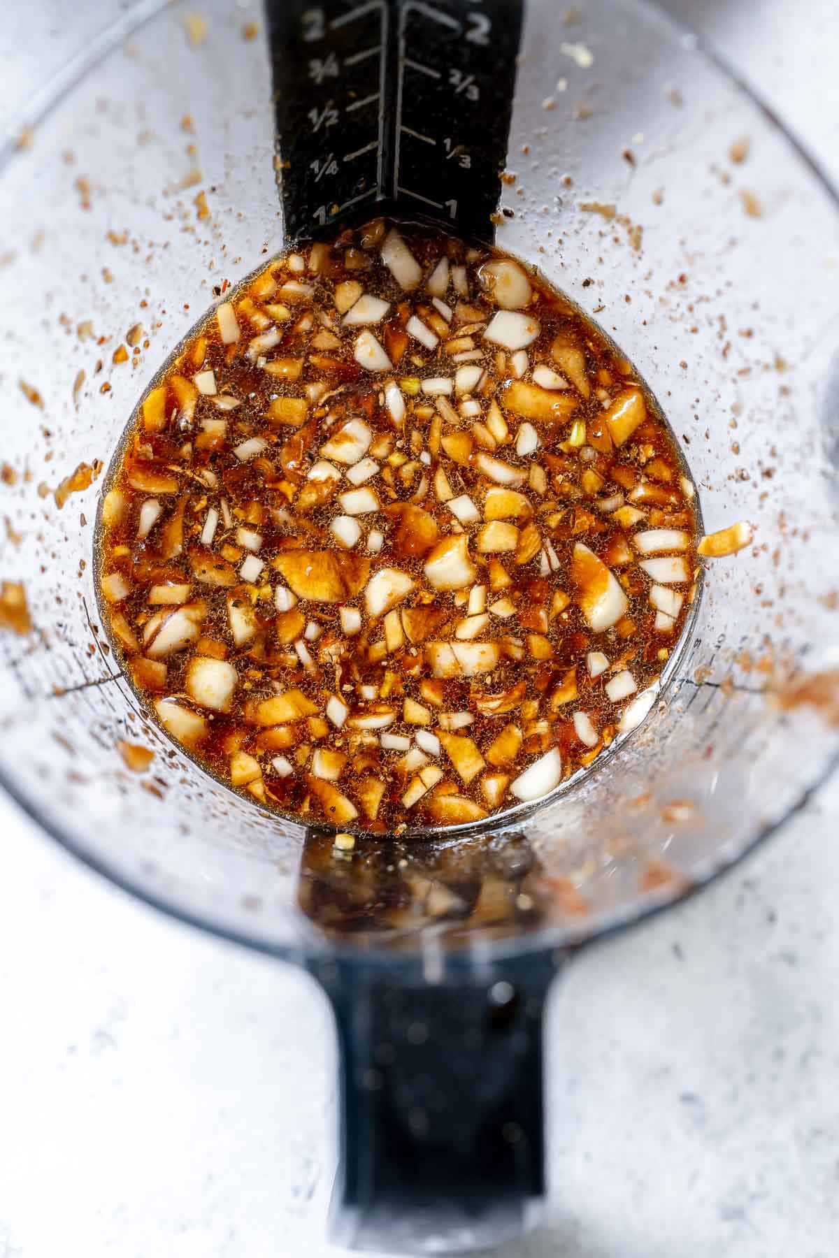 A close shot of liquid ingredients in a measuring cup.