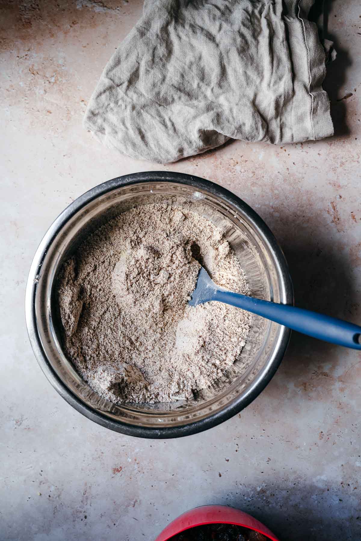 A mixing bowl with dry mixed ingredients.