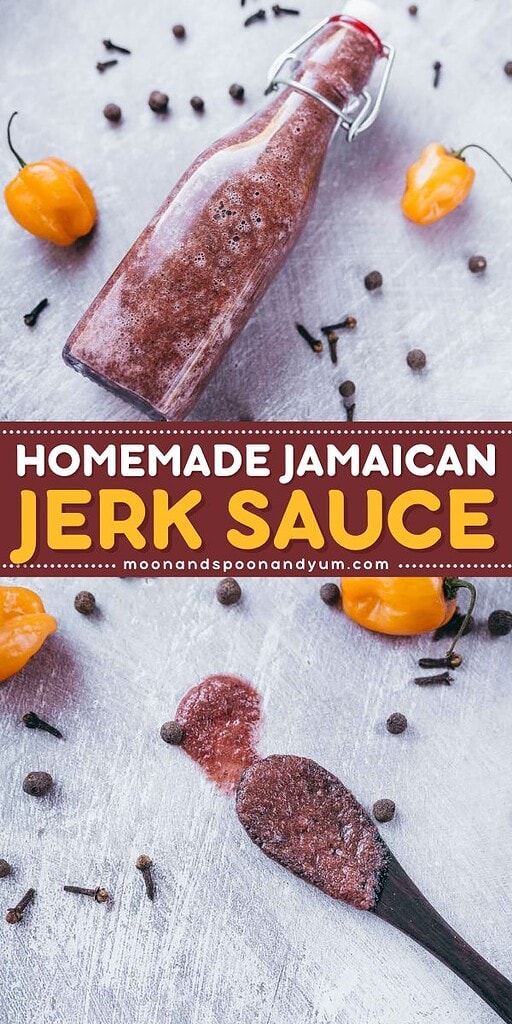 A bottle of homemade jerk sauce sits on a light surface, surrounded by scattered spices and fiery habanero peppers, with a spoonful of the vibrant jerk sauce nearby.