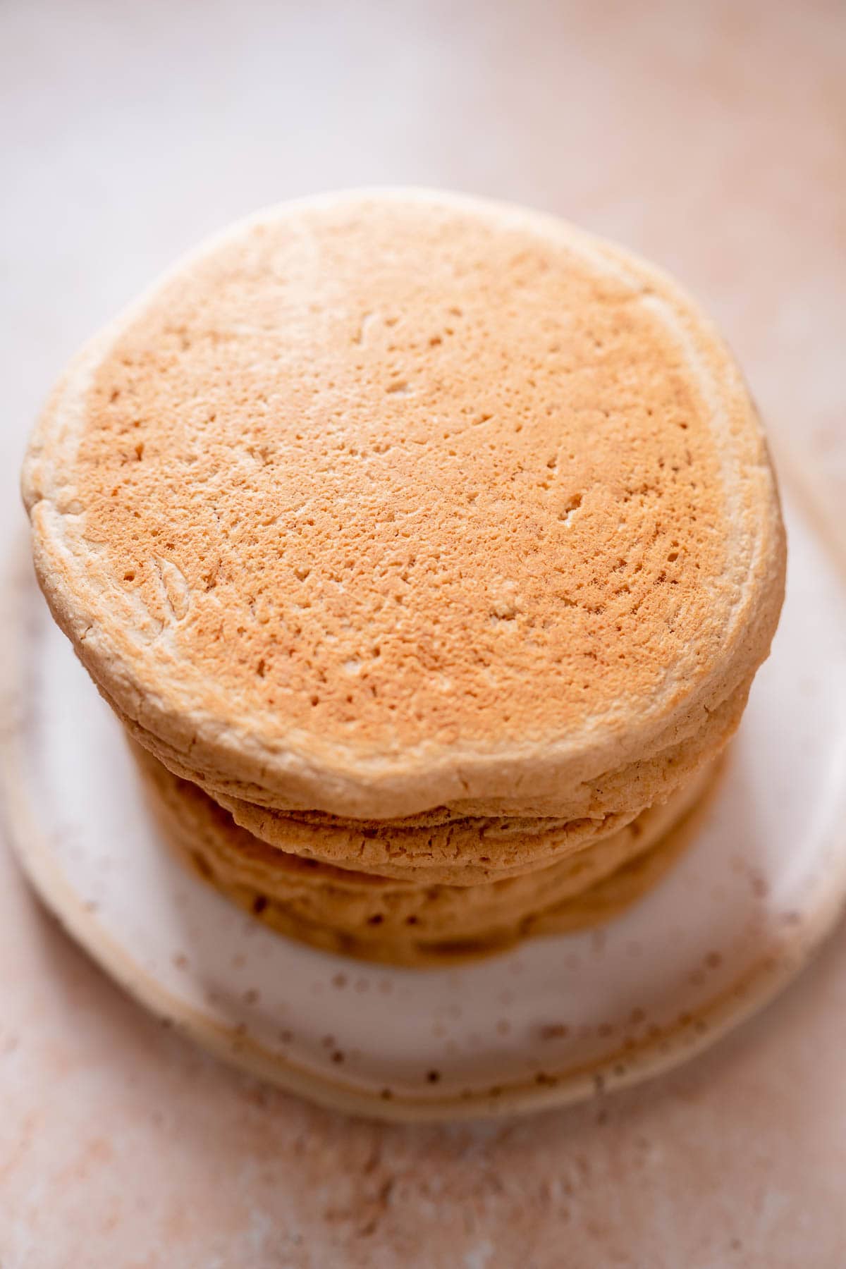 A stack of freshly made golden brown pancakes.