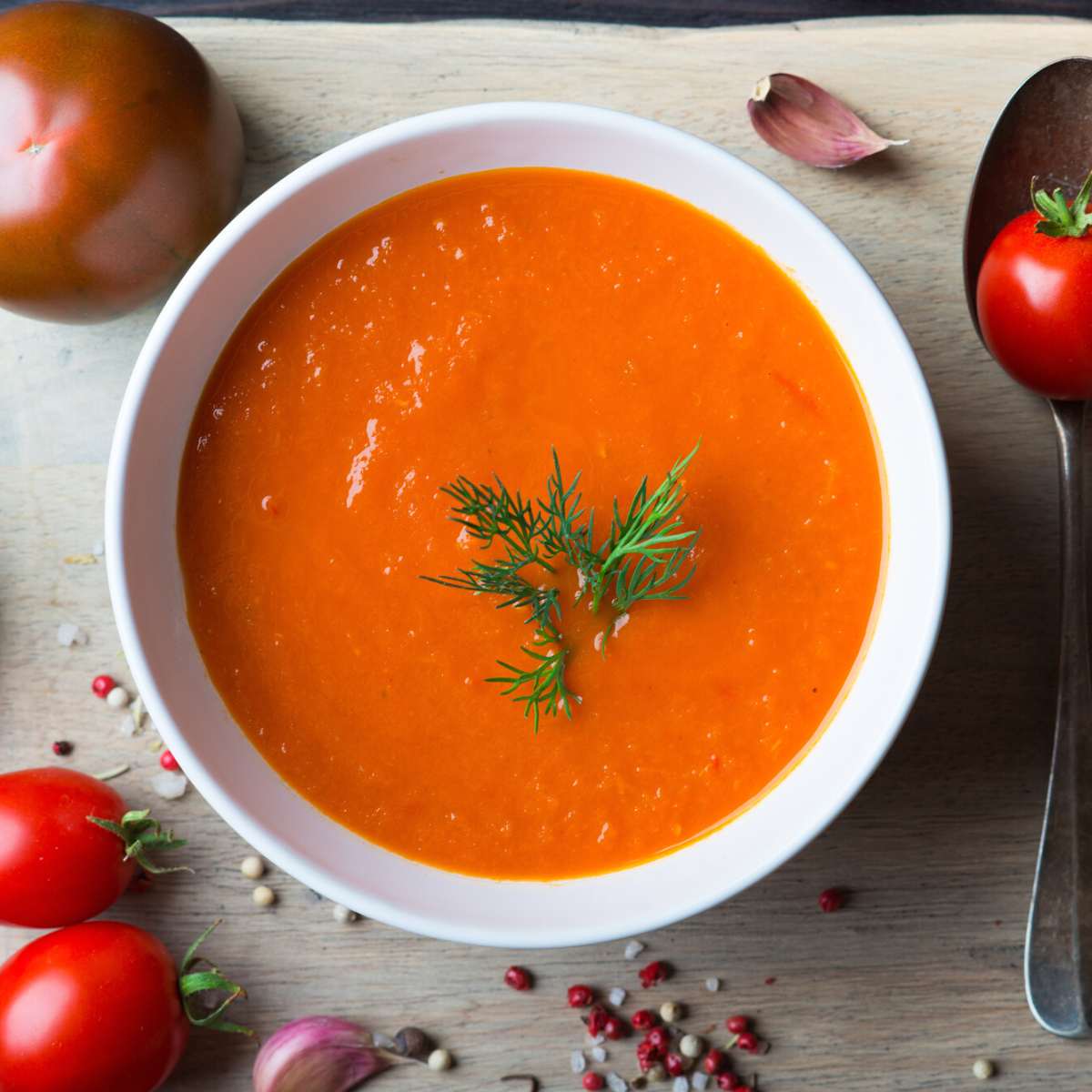 A white bowl filled with red soup.