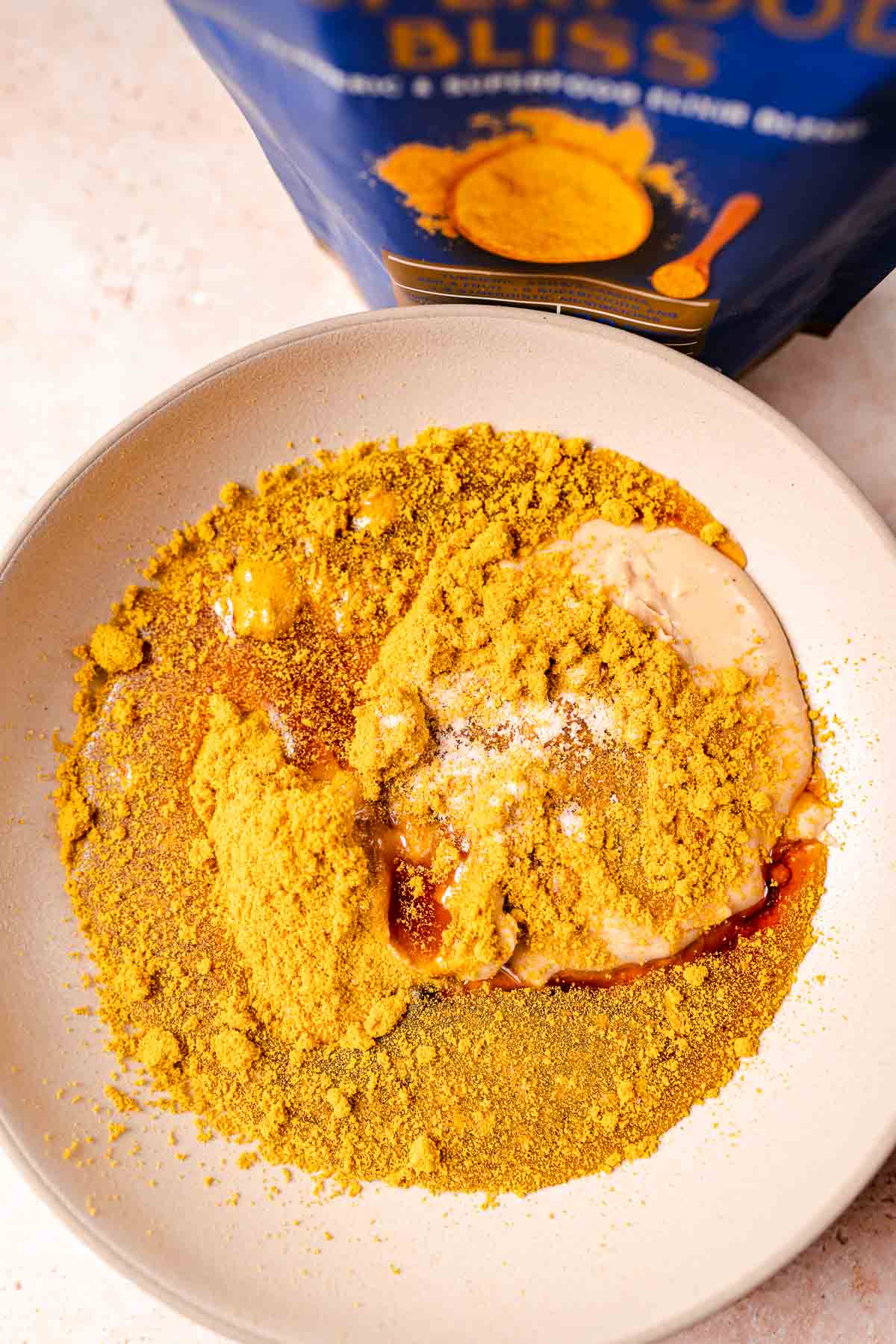 A bowl filled with yellow powder.